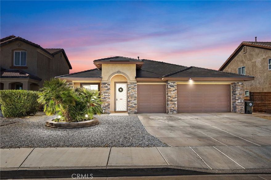 Bright, Comfortable, and Perfectly Set Up for Everyday Life. This single-story charmer has all the space, style, and comfort you’ve been looking for! With over 2,000 sq ft of living area, this 3-bedroom, 2-bath home features a layout that just makes sense — an open kitchen with light cabinetry, granite tile counters, and plenty of prep space, plus both a formal dining area and separate living and family rooms. The family room fireplace and warm wood flooring create an inviting atmosphere for everyday living. Step out back to a large covered patio designed for easy entertaining and weekend BBQs. The 3-car garage offers extra room for storage or hobbies, and the low-maintenance front yard keeps your weekends free for fun. Situated in a great neighborhood near shopping, schools, and commuter routes — this is the kind of home that feels good the moment you walk in.