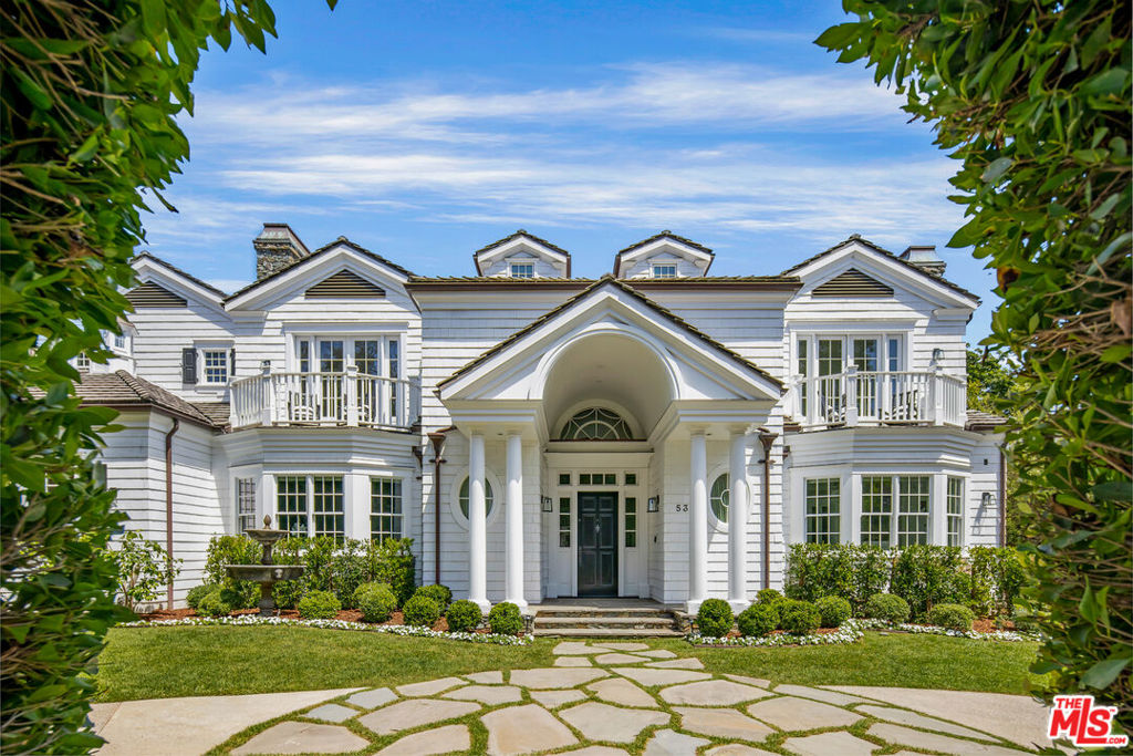 This one has it all. Built in 2009, the owner spared no expense in constructing this timeless home for his family. The attention to detail is showcased by the double height foyer adorned with wainscoting and millwork, which is carried throughout the entire home. The home has a timeless "East Coast Traditional" aesthetic with all the amenities of a modern build. Featuring an elevator, gym, sauna, seven fireplaces, six car garage, four private balconies, two mudrooms, built-in vacuum, backup generator and 1,500 bottle wine cellar. The second floor features four bedrooms, each en suite with a private balcony. The primary suite is a true retreat with a luxurious bathroom complete with a soaking tub, walk-in steam shower, dual closets, wash closets and vanities.There is another en suite bedroom suite on the ground level. All bedrooms are flooded with natural light and windows with beautiful views. The gourmet kitchen is a chef's dream, featuring top-of-the-line Miele appliances, four ovens, custom cabinetry, and a generous center island. The open concept layout seamlessly connects the living spaces with the kitchen and backyard, fostering an ideal flow for both entertaining and everyday living. Outdoor kitchen features all Viking appliances, heaters, and fireplace. The lot is completely private, surrounded with mature hedges in the front and back yards. This is a special property, located on one of the most private streets in the coveted Palisades Riviera. 532 Spoleto provides the best value in the Pacific Palisades, Brentwood, or Santa Monica!
