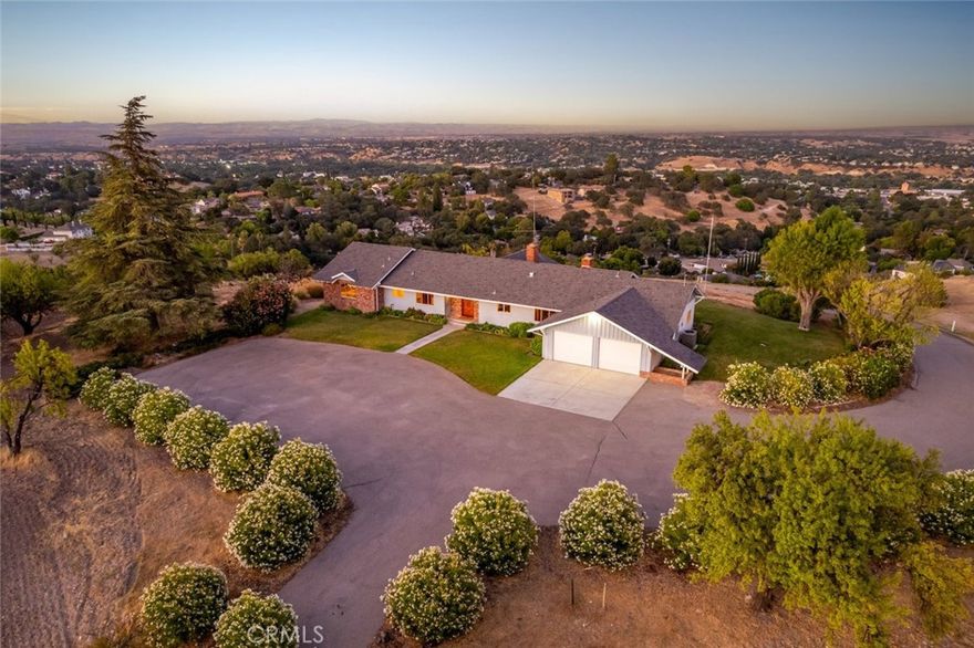 Perched above the heart of Paso Robles, this exceptional hilltop estate offers breathtaking panoramic views and a once-in-a-generation opportunity. Held within the same family since its construction in 1958, the single-level ranch-style home sits in quiet prominence atop a secluded lane, accessed by a private gate. Encompassing 2,425 square feet, the meticulously maintained residence features 4 spacious bedrooms and 3 baths, blending timeless charm with remarkable potential. Spanning three contiguous parcels totaling 2.24 acres, this legacy property presents unmatched versatility—perfect for a private compound, investment, or potential future development. The primary homesite (Lot 1) includes 1.13 acres with the main residence, while Lot 4 (0.64 acres) and Lot 3 (0.47 acres) offer a blank canvas for expansion, additional dwellings, or resale. Sweeping, unobstructed views stretch across the city and the rolling hills beyond, offering a rare combination of privacy, elevation, and proximity to town. Rarely does a property of this stature and location become available—an authentic Paso Robles original, rich in history and poised for its next chapter.