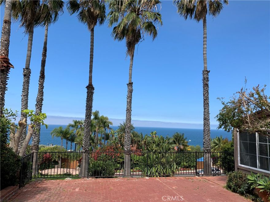 AMAZING OCEAN VIEWS FROM MOST EVERY ROOM IN THE HOME!!. Short walking distance from Thousand Steps Beach which is considered to be one of the finest beaches in all of Southern California. This is a large 5 bedroom, 2 bath, 3 fireplace, 2 patio, PLUS 4 hole putting green charming home. Perfect home for entertaining in either the large front brick patio or the rear backyard that includes putting green. The home features upgraded cabinets and counter tops thru out the home. Recently installed LVP flooring in multiple rooms. Kitchen features its own fireplace, newer stainless appliances, plenty of counter space, and a large nook which is perfect for family meals or just relaxing while watching the Catalina sunset. The home also has parking in a large 2 car carport with additional space for another 3 cars all acessable from Virginia Way. Note that Virginia Way dead ends into the carport which eliminates any thru traffic. There is also plenty of parking on PCH. Property also has large upstairs laundry room which leads to rear back patio/putting green, and a exterior storage room which is perfect for surfboards, bikes, and beach chairs. Upstairs master bedroom features a fireplace, vaulted ceilings, and balcony facing the ocean. Note that the rent includes water, trash and Gardner. This is a must see and won't last long.