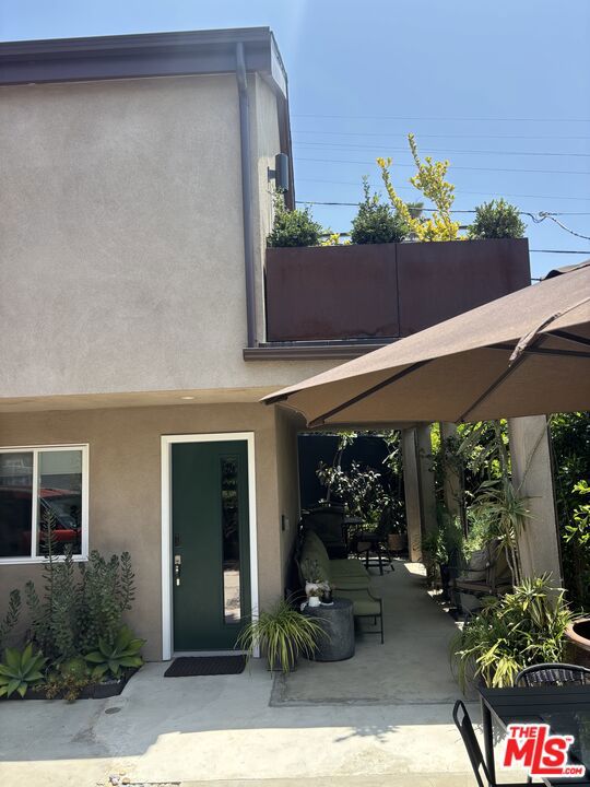 HIDDEN GEM- This brand new, FULLY FURNISHED move- in- ready 1 bedroom, 1.5 bath Apartment sits above a detached garage, offering 1,277 sq ft of thoughtfully designed living space ( plus 1 parking spot in a shared garage) and featuring vaulted ceilings, oversized windows and skylights. The deluxe unit is flooded with natural light, boasting city lights and treetop views. Enjoy a sleek, modern kitchen with custom cabinetry, stainless appliances, a wine refrigerator and a unit washer/dryer. Step outside onto one of two private decks perfect for relaxing or entertaining. Additional highlights include concrete, cork, tile flooring and central air/heating. private entrance with stair access. Utilities such as water , internet and an electric car charger (slated to be installed shortly) are included. Pet accommodations considered on a case-by-case basis. Located in the heart of Mid-City, this 1 Bedroom BEAUTY offers quick access to parks, shopping, dining, public transit, Downtown LA, Culver City , Santa Monica and LAX.