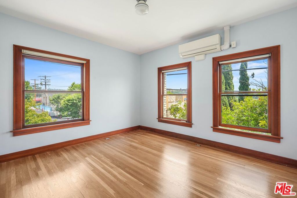 This top-floor corner unit features hardwood flooring throughout, a full kitchen with built-in seating area, and a split system heating & air unit. The large double-hung windows allow for plenty of natural light and offer views of downtown Eagle Rock and the hillsides beyond. Located in the Jennie Brayton Building: a 2-story mixed-use Art Deco building designated an Historical Cultural Monument in 2020. This unit combines historic charm with the convenience of urban living. Located in the heart of downtown Eagle Rock, this unit is walking distance to all of the hot spots along Colorado & Eagle Rock Boulevards. Conveniently located minutes to Occidental College.
