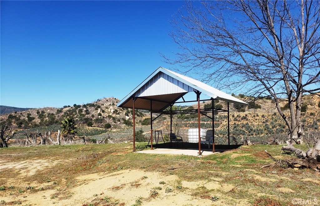 Nearly 10-acre lot has everything you have been searching for. Level to gently sloping lot with amazing views, recently drilled well (no pump installed), 2 inch water meter, electricity at the property line, new vinyl fencing and gate, and a seasonal stream. This former avocado grove has the potential for an estate home
site, vineyard, grove, horse property, and the association allows for manufactured homes.