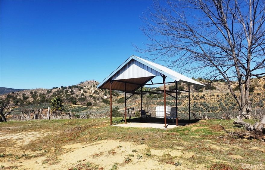 Nearly 10-acre lot has everything you have been searching for. Level to gently sloping lot with amazing views, recently drilled well (no pump installed), 2 inch water meter, electricity at the property line, new vinyl fencing and gate, and a seasonal stream. This former avocado grove has the potential for an estate home

site, vineyard, grove, horse property, and the association allows for manufactured homes.