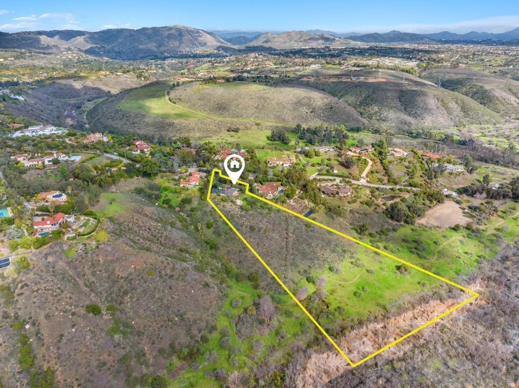 Discover an unparalleled opportunity to own a timeless treasure in Rancho Santa Fe. This exquisite property, set in the prestigious Covenant of Rancho Santa Fe, offers 6.11AC of picturesque landscape & breath-taking views! Featuring a single-level, original ranch-style home w 5BD & 3.5BA. A 1966 original w classic charm & character, provides a peaceful, secluded sanctuary w south west breathtaking panoramic views. Plans have been completed and submitted. The property is well-positioned to offer the best of both worlds—serene country living & just moments away from the vibrant amenities of RSF. The RSF Covenant grants exclusive access to 60 miles of scenic walking/ running trails, the esteemed Roger Rowe Schools, + 24/7 security, ensuring both luxury and peace of mind. This home, in its original condition, invites the next owner to transform it into a personalized haven. Architectural and grading plans have already been paid for and submitted, paving the way for your vision. Seize this rare chance to create your dream sanctuary in one of the most sought-after communities.