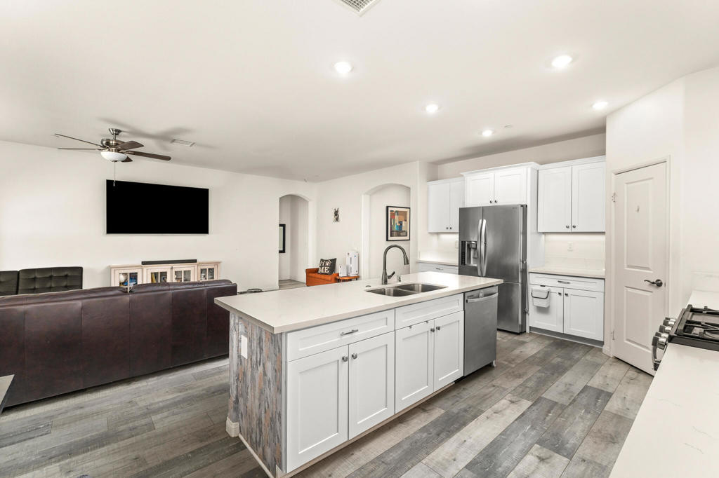 Discover this living experience, in the heart of Indio, just moments away from the world-renowned Coachella and Stagecoach Festivals. This stunning, newer home blends modern elegance with unbeatable comfort, offering a perfect retreat in a vibrant community of only 24 homes. From the moment you step inside, you'll be greeted by beautifully upgraded flooring and countertops that complement sleek, contemporary finishes throughout. The gourmet kitchen is a true highlight, featuring stainless steel appliances, abundant storage, and premium fixtures--ideal for both casual meals and gourmet entertaining.The home offers tranquil bedrooms, each designed as a peaceful sanctuary for rest and relaxation. Outside, the private backyard has extra cement, A standout feature is the attached GUEST CASITA, which provides a stylish space for visitors or can be transformed into your personal office or studio. Set in a well-maintained, newer gated community, this home offers the ultimate blend of privacy, convenience, and resort-style living. Don't miss the chance to make this exceptional property yours. Embrace elegance, comfort, and the lifestyle you deserve--all in the heart of the Coachella Valley. Welcome to your new home!