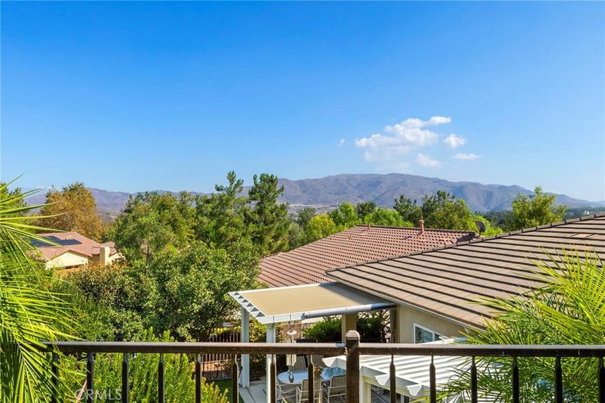 Highly upgraded one story, city view home located in the sought after 55+ gated community of Trilogy at Glen Ivy! This "Chaparral' plan is the largest floor plan in the Trilogy community. This home features a gourmet Chef's dream kitchen featuring upgraded granite counter tops, custom wood cabinetry with self-closing drawers, butler's pantry, huge Island with bar, commercial grade stainless steel Viking and Miele appliances, convection oven, warming drawer, hood with heat lamps and racks. A very open floor plan with the great room with custom window coverings, ceiling fans and that is right off the kitchen with fireplace and is perfect for entertaining. You have 180-degree city views off the back of the property with a fire ring, exterior bar with easy care patios and landscaping surrounding this home. Enjoy gardening with your raised planter boxes. For pet lovers, it has a convenient side yard dog run with synthetic grass. This home also has a three-car garage. In this community the HOA does all the front yard landscaping for you. The primary bedroom is over sized with plantation shutters, located in the back of the house so you can enjoy those city views from your primary bedroom. The primary bathroom has a custom walk-in soaking tub, separate oversized shower, mirrored wardrobe closets with walk in closet with built-ins. The custom office has built-ins throughout. In this 55+ community you have low HOA dues that include, pickleball, tennis courts, bocce courts, indoor and outdoor pools/spa, BBQ and outdoor fireplace, fitness center with indoor track and gym. There are endless clubs to join as well. The Trilogy Golf Club and clubhouse can be enjoyed as well for a separate fee. You are not only buying one of the nicest homes in Trilogy you are buying an entire new lifestyle by living in the sought after 55+ community of Trilogy at Glen Ivy.  See this one today as it will gone tomorrow!