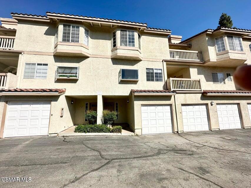 Welcome to this stunning townhome nestled in the serene community of Shadow Ridge. This highly sought after 2 bedroom and 2.5 bathrooms home is a rare find with a garage that includes direct access to the unit. The main floor offers an abundance of natural light, a well-sized kitchen with a breakfast nook, and a dedicated dining area. The living room has a cozy fireplace and mountain views from the patio. Upstairs you'll find 2 oversized bedrooms. Both with walk in closets and ensuite bathrooms. The is also a second balcony from the top floor. Besides the garage there is also an assigned covered parking space. Washer & dryer in unit, cable TV and internet are included. Community amenities include a pool, gym, racquetball court, and more. Located in the heart of the award-winning Oak Park School District. Owner is updating the primary bathroom, kitchen appliances, and kitchen lighting.