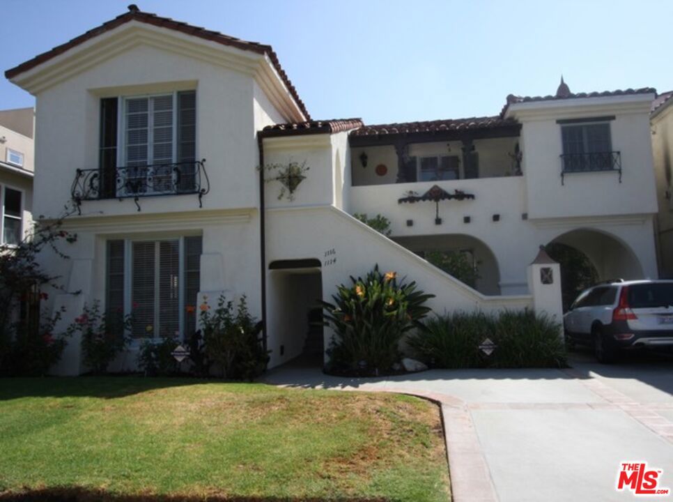 Simply Stunning! Drop-Dead Gorgeous Renovation! This beautifully reimagined home features top-of-the-line hardwood floors throughout, soaring high ceilings, and a cozy wood-burning fireplace in the sunken living room, framed by a charming arched picture window that floods the space with natural light. The remodeled kitchen is a chef's dream, complete with Caesarstone countertops, a stylish apron sink, and refurbished vintage cabinetry with original hardware. Enjoy brand-new appliances, including a stove, refrigerator, dishwasher, and a built-in wine/beverage fridge . There's a formal dining room, a sunny breakfast room, and a separate laundry room with a new washer and dryer . Both bathrooms have been meticulously restored in classic Art Deco style, and original built-ins throughout the home have been lovingly brought back to life. Don't miss the charming phone nook in the spacious center hall, and did we mention the abundance of closet space? Hurry, this gem won't last!