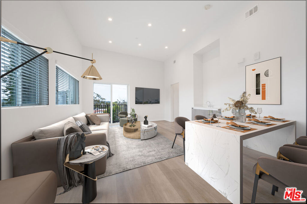 This spacious 3 bedroom unit has approximately 1,500 square feet of living space. The kitchen and living area are open with plenty of light from the windows and balcony. All 3 bedrooms have en suite bathrooms with an additional 1/2 bath for guests. Modern features include stainless steel appliances, recessed lighting, beautiful flooring, built-in cabinets, and washer/dryer in unit. Two tandem parking spaces in an underground and gated garage. Photos may virtually staged or from a similar unit in the building. Available for immediate move in.