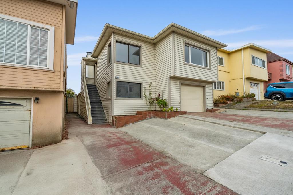Welcome to 285 Skyline Drive, a bright and inviting home perched in the hills of Daly City with sweeping ocean views. This 2-bedroom + 2 bonus room, 1.5-bath home offers 1,570 sq ft of thoughtfully designed living space, blending timeless character with modern updates. Exposed beams, a cozy fireplace, and large windows fill the living area with natural light. Fresh interior paint, updated light fixtures, and refinished hardwood floors create a warm atmosphere throughout. The kitchen features newly epoxied counters, refreshed cabinets, and durable new vinyl flooring both stylish and functional. Two spacious bedrooms offer comfort, & the bathroom has updated epoxy finishes for a clean, modern feel. Downstairs, two bonus rooms provide flexibility for a third bedroom, office, or media space, with direct access to the low-maintenance paved backyard. An upper deck offers stunning ocean views perfect for relaxing or entertaining. A 2-car tandem garage provides ample parking and storage. Conveniently located near Westlake & Serramonte shopping, parks, trails, public transit, and major highways with easy access to SF and Pacifica beaches. Don't miss this well-appointed home offering natural light, outdoor space, & versatility in one of Daly City's most scenic and connected neighborhoods.