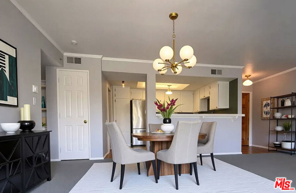 Ideally located in the heart of Mar Vista, this spacious upper-corner 1 bedroom, 1 bath back unit condo offers comfort and convenience in a well-maintained, controlled-access building. The bright living area features a decorative fireplace as its focal point and opens to a quiet, large private balcony. The semi-open kitchen comes fully equipped with a stove, dishwasher, microwave, refrigerator, and in-unit washer/dryer neatly tucked away in a closet for added convenience. The generous bedroom includes large windows, mirrored double closets, and direct access to a full bath with a shower/tub combo. This unit also includes two assigned covered tandem parking spaces in a secure underground garage. Just steps from local favorites like Beethoven Market, Taverna at The Mar Vista, The Farmers Market, Awaken Cafe, Little Fatty, CVS, and more, this home offers the perfect blend of comfort and vibrant neighborhood living. (Some photos have been virtually staged.)