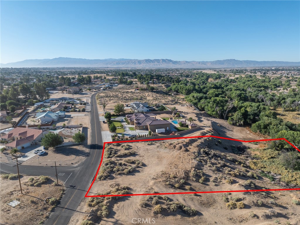 Are you looking for an Estate Property? If so come look at this lush 4.0 acre lot backing up to the Mojave River with a view o the city and mountains beyond. You can build your dream home and here and use the lower portion for endless possibilities. Perfect are for livestock, horses and other farm animals. This parcel also includes a massive amount of fill dirt already there for your use. Nestled between the beautiful estate to the south, and AV Ranchos water station to the North make is a perfect location for your dream home!