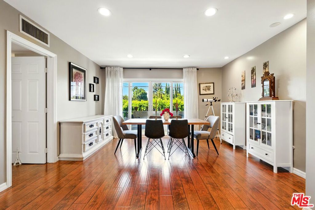 Welcome to 12955 Riverside Dr #210 a beautifully updated 2 bedroom, 2 bath condo with a spacious bonus room in the heart of Sherman Oaks! Tucked away at the quiet rear of the building, this north facing unit offers peaceful treetop and pool views, creating a private retreat from the city buzz. Inside, enjoy beautiful vinyl flooring throughout, an open concept living and dining area, and a stylish kitchen with granite countertops, perfect for entertaining or relaxing at home. A large bonus room offers incredible flexibility, ideal for a home office, gym, guest space, or generous extra storage. You'll also love the two spacious balconies for morning coffee or evening unwinding. The primary suite features ample closet space and a private bath, while the second bedroom is equally roomy. Additional perks include two parking spaces in the gated garage and the rare ability to install an in-unit washer/dryer. The building offers a well-maintained pool and is perfectly located near Whole Foods thats 1 block away, top dining on Ventura Blvd and Sportsmen's Lodge, shopping, and easy freeway access.Don't miss the chance to own this versatile and stylish condo in one of Sherman Oaks' most convenient and desirable spots!