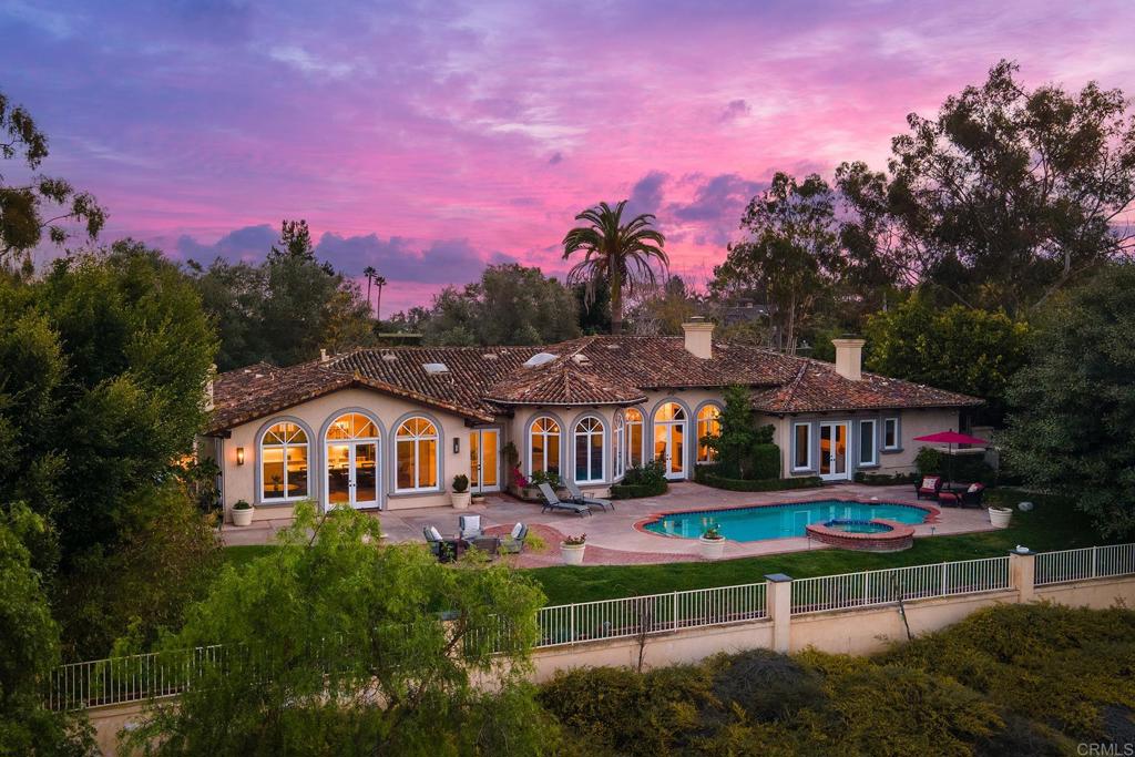 Welcome to this exquisite single-story remodeled home, nestled in the prestigious guard-gated enclave of Rancho Santa Fe Farms — a small, intimate community known for its privacy, elegance, and world-class golf. Perfectly positioned along the renowned Farms Golf Course, this home offers an exceptional blend of luxury, comfort, and breathtaking natural beauty. With 4 spacious bedrooms, office, and 3.5 thoughtfully designed bathrooms, this home provides the ideal setting for both relaxed everyday living and entertaining. The open-concept floor plan flows effortlessly between the living, dining, and kitchen areas, creating a light-filled and inviting atmosphere. The gourmet kitchen is a chef’s dream, featuring top-of-the-line appliances, custom cabinetry, a large center island, and exquisite countertops. It opens seamlessly to the living room, where a cozy fireplace and expansive windows frame captivating views of the golf course and surrounding mountains. The primary suite is a private retreat, with stunning views and a spa-inspired bathroom with a freestanding soaking tub, walk-in shower, dual vanities, and two generous walk-in closets. Each additional bedroom is generously sized, with abundant natural light and ample closet space. Combining timeless design, high-end finishes, and a premier location, this one-of-a-kind home offers the ultimate in RSF living.
