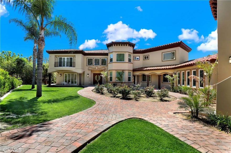 Exquisite Riverside Estate in Alessandro Heights – A Private Paradise Awaits Welcome to your own piece of paradise nestled in the prestigious White Gate community of Alessandro Heights, one of Riverside’s most sought-after neighborhoods. Tucked just off Overlook Parkway, this grand estate offers over 8,800 sq ft of luxurious living space, plus a private casita perfect for guests or multi-generational living. From the moment you step through the front doors, pride of ownership is evident throughout. Enter into a stunning grand foyer featuring a dramatic spiral staircase, Italian marble floors, and soaring cathedral ceilings adorned with opulent chandeliers. The formal living room, anchored by a stately fireplace, flows seamlessly into the elegant dining room, both appointed with custom Italian furnishings that evoke timeless sophistication. An arched hallway leads you to the heart of the home: a massive family room with a second fireplace, built-in bar, and a sunlit breakfast nook that opens to the lush backyard. The chef’s kitchen is a dream come true, equipped with dual islands, Monogram appliances, gleaming midnight sparkle granite countertops, and an abundance of custom cabinetry — perfect for both everyday living and grand-scale entertaining. The first floor also boasts a secondary family room for private gatherings or use as an additional bedroom, a spacious office with dual entry, a large laundry room, and a versatile bonus room just off the garage. Dual staircases provide easy access to the expansive second level, where you’ll find four ensuite bedrooms, including a showstopping primary suite with its own kitchenette, a spa-inspired bathroom with an oversized soaking tub, and a massive walk-in closet. Also, Furniture can be discussed with terms. Outside, the fully gated estate includes a private security gate, expansive driveway with ample parking, and an oversized garage—each bay with its own dedicated storage room. The meticulously landscaped backyard is an entertainer’s dream with multiple covered patios, a fully-equipped outdoor kitchen with BBQ, sink, fridge, and generous counter space, ideal for hosting events or relaxing with family. Descend to your own resort-style pool with beach entry and water features, all set within a tranquil, private setting.

Call today to schedule your private, pre-approved tour!