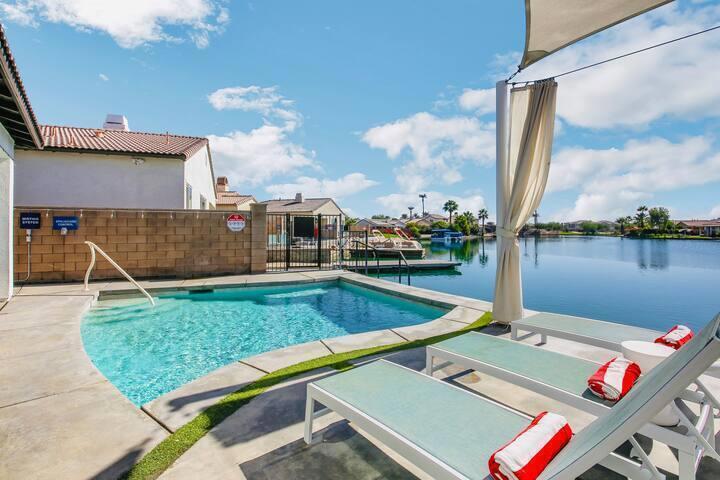 Welcome to this beautifully designed 3-bedroom, 2-bath lakefront home in the highly sought-after gated community of Terra Lago. Spanning approximately 1,720 sq. ft., this turnkey property is furnished per inventory list and ready to generate immediate short-term rental income or serve as your personal desert getaway.Enjoy seamless indoor-outdoor living with an open-concept layout that leads to your private pool and spa, all set against the backdrop of stunning lake and mountain views. The home is thoughtfully designed for both comfort and entertainment, featuring designer finishes, spacious living areas, and a chef's kitchen with granite countertops and stainless-steel appliances.Step outside to your own waterfront paradise--complete with private dock access, firepit lounge, and outdoor dining area ideal for gatherings under the desert sky.Centrally located just minutes from Coachella, Stagecoach, Indian Wells Tennis Garden, and El Paseo's shopping and dining, this property offers exceptional income potential and year-round demand from vacationers and festivalgoers alike. Whether you're expanding your short-term rental portfolio or seeking a luxury escape with passive income, this is your opportunity to own a proven performer in one of the desert's most desirable communities.