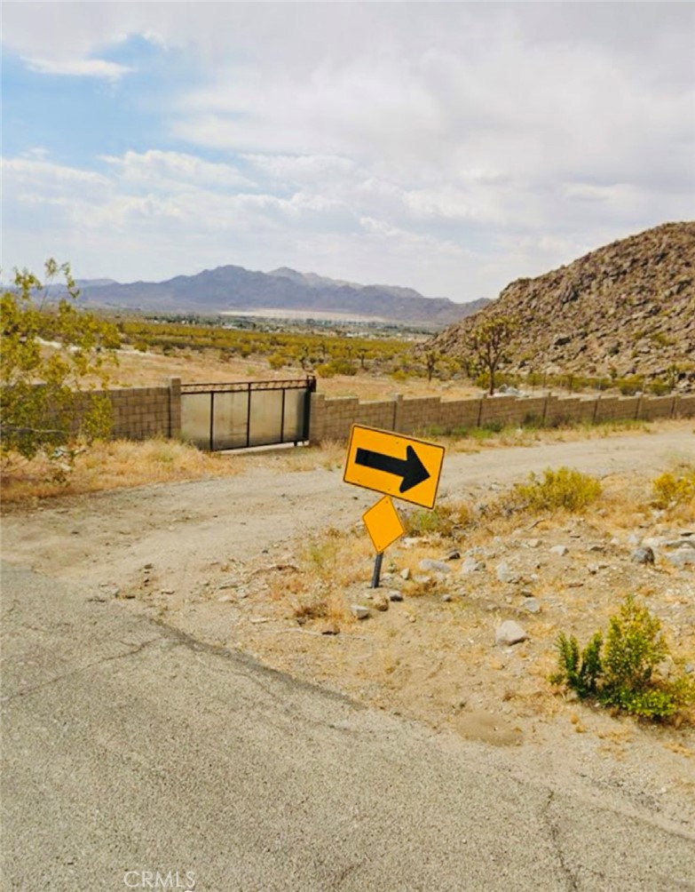 Great Site For the Custom Home.. What a View From this 2.5 Acres of The Mountain and Valley.. This Flat Parcel Offers Front Block Fencing with Wrought Iron Gate, Plus Wrought Iron Fencing all Over, Lot it's been cleaned up and It's Ready to Build.. Water is Connected, Electric Pole Is Across of Street.. Don't Miss Out this Fantastic Opportunity to Create Something Special in a Growing Neighborhood..