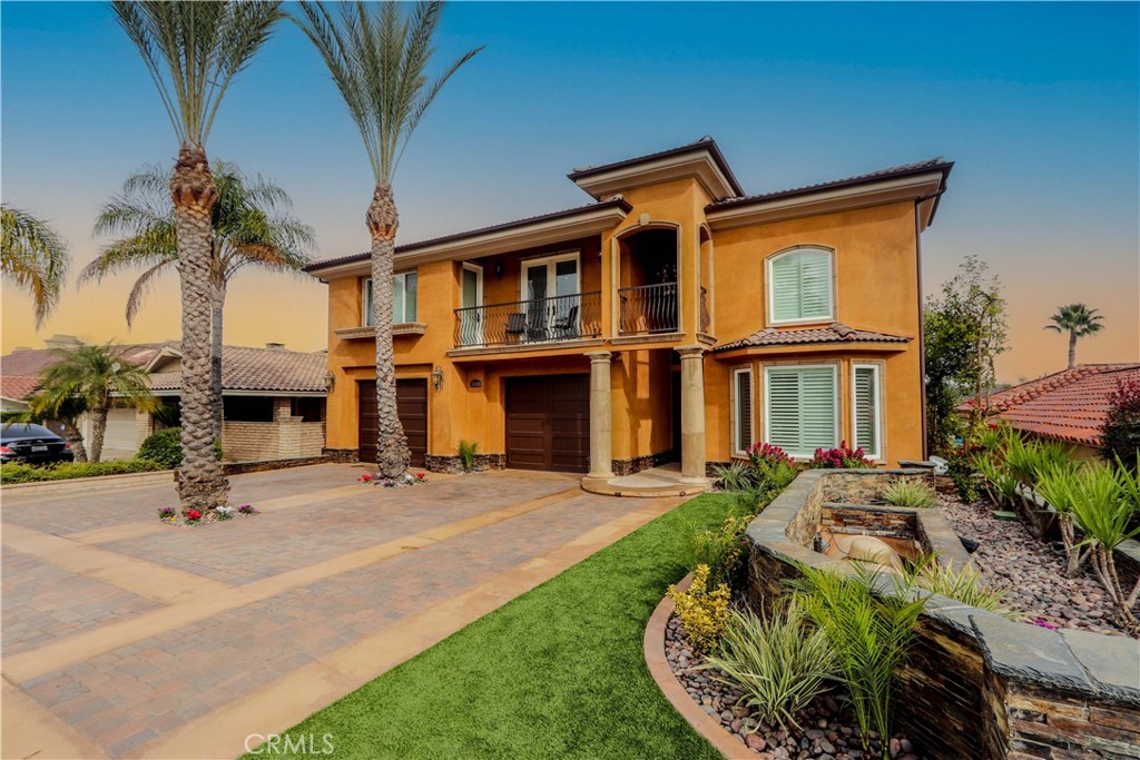 This spectacular and custom-built lake front estate is like no other to ever hit the market in Canyon Lake! The resort-style lot is ideally situated on Canyon Bay offering solitude and privacy from the busier main lake and encompasses a private beach with over sixty-five feet of lake frontage and a boat dock. Lake enthusiasts and boaters cruising by are awed by the magnificent architecture and the grandiose infinity pool, spa, waterslide and scintillating stacked-stone waterfall. The expansive residence spans nearly 9,000 sq ft including six bedrooms, eight bathrooms, two full kitchens, an office, a large loft area, separate guest/maid quarters, two laundry rooms, a pool-house, a massive home theatre with seating for sixteen people, a three-car garage and a separate storage area. Rebuilt in 2009, the property design consists of three spacious levels that provide an open floorplan that can easily accommodate multi-generational living if that is desired. The grand entrance incorporates a travertine walkway framed by stacked-stone leading to an impressive decorative glass door. The main level displays soaring twenty foot ceilings, a chef’s kitchen with restaurant-quality Viking appliances including a freestanding range and hood complete with six burners, griddle and a kettle faucet, a separate oven, microwave, warming drawer, three undercounter wine-cellar refrigerators, an oversized island with built-in refrigerated drawer, a walk-in pantry, custom cabinetry and a dumbwaiter that services all three levels. Also found on the main level is the formal living and dining rooms, an office, a powder room for guests and the primary bedroom complete with floor to ceiling windows and private balcony overlooking the lake, a large walk-in closet and a spa-like en-suite bath. The second level includes three large bedrooms with walk-in closets, two bathrooms and a large loft area. Downstairs from the main level is the third level that offers two more bedrooms, two bathrooms, a second kitchen, dining area, family room, a massive home theatre and an impressive balcony offering al fresco dining and a seating area with firepit. The tropical pool area is an entertainer’s dream including an oversized spa, waterslide, built-in BBQ area, boat house with outdoor bathroom, roof deck located over the boat house and a guest/maid quarters and storage area. Capture the serenity and soak in the essence of the luxury lake lifestyle with this iconic property.