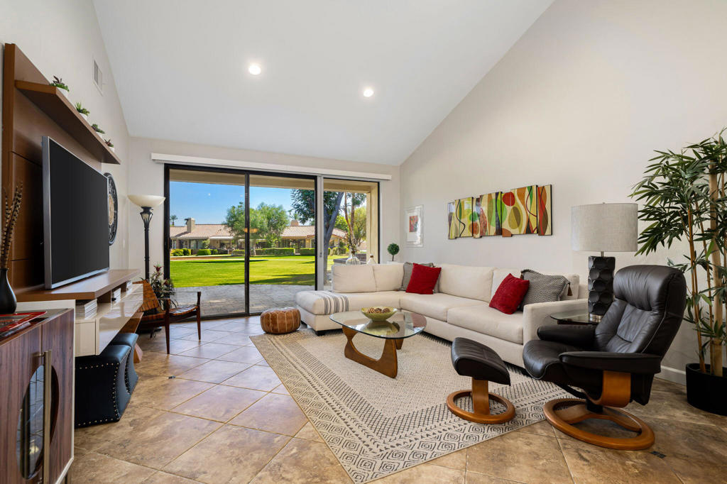 Golf Course Living at Its Finest in Monterey CC! This beautifully updated 2BD/2BA home welcomes you with a private landscaped courtyard and stylish modern finishes throughout. Features include porcelain tile floors, high smooth ceilings, fresh paint, 6' baseboards, clerestory windows, new LED lighting, and sliding doors that flood the home with natural light. The kitchen shines with newer stainless appliances and brand-new quartz countertops, flowing seamlessly into the dining and living areas with views from every angle. The primary suite boasts an updated spa-like bath with designer tile shower and direct patio access, while the guest bedroom opens to the serene courtyard. Additional highlights: new toilets in both baths, electric window coverings, indoor laundry, ample storage, and a 2-car garage. The extended back patio, finished with new pavers, captures panoramic golf course and mountain views--perfect for entertaining. Offered designer furnished, with a community pool just steps away. Enjoy the unbeatable Monterey CC lifestyle with 27 holes of golf, 19 tennis courts, pickleball, 37 pools/spas, and a prime location minutes from El Paseo shopping and dining.