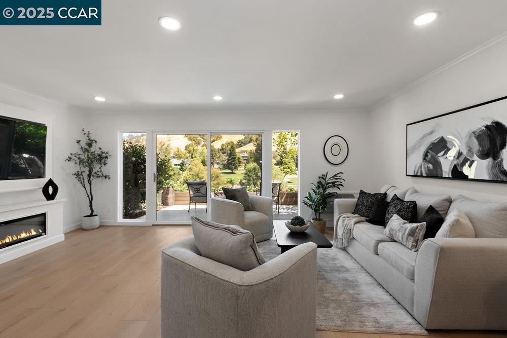 Wake up to sweeping views of the 14th fairway and the rolling hills beyond in this gorgeous remodeled 3BD/3BA Rossmoor townhome. Designed for today’s lifestyle, the reimagined floor plan features an enlarged kitchen with white cabinetry, quartz counters, herringbone backsplash, stainless steel appliances, and a peninsula with island-style seating—perfect for casual meals or entertaining. The primary suite is a retreat with golf course views, walk-in closet, dual sinks, medicine cabinets, designer-tiled shower, and an electric fireplace. A second upstairs ensuite offers a full bathtub, while the downstairs bedroom doubles as an office or guest space, complete with extra storage. Luxury vinyl plank flooring, recessed lighting, designer fixtures, new dual-pane windows/sliders, and built-in dining storage add style and comfort. Each room enjoys its own heating/AC controls. Relax on the tiled patio and take in the scenery, with convenient parking just steps away. Located in Rossmoor’s vibrant 55+ community, residents enjoy access to golf, pickleball, swimming, tennis, a top-notch fitness center, movie theater, art and hobby studios, and nearly 200 clubs and organizations.