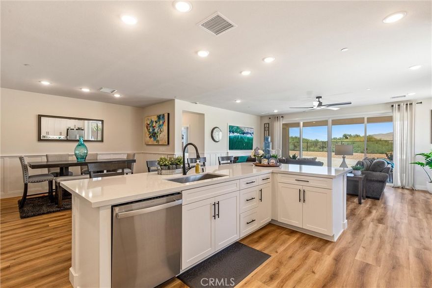 Discover the ultimate desert lifestyle in this stunning 2024-built home located in the prestigious Four Seasons at Terra Lago, an exclusive 55+ gated community in Indio. This immaculate residence offers 2,166 square feet of thoughtfully designed living space with 2 bedrooms & 2 bathrooms, perfect for active adults seeking comfort and elegance.

Step inside to find a beautifully upgraded interior featuring custom wainscoting, designer light fixtures, premium faucets, stylish backsplash, and upgraded flooring throughout. These carefully selected finishes elevate the home beyond builder-standard, creating a sophisticated ambiance that's move-in ready. The stunning 15-foot sliding glass door seamlessly connects indoor and outdoor living, flooding the home with natural light while framing those spectacular mountain views.

The home's standout feature is its expansive backyard—an open canvas ready for you to design your own outdoor oasis. Enjoy breathtaking mountain views and the spectacular desert sunrises and sunsets that make this area so desirable. Whether you envision a sparkling pool or lush desert landscaping, this blank slate overlooks the 17th green and tee box for the 18th hole of The Golf Club at Terra Lago.

Security and peace of mind come standard with the community's 24-hour guard-gated entrance, ensuring a safe & private environment for all residents. Four Seasons Terra Lago boasts an impressive 22,000 sq ft recreational facility featuring a state-of-the-art fitness center, full-service salon, yoga/aerobics studios, library, billiard room, ballroom, bistro, & both indoor & outdoor pools. Stay active with golf, tennis, pickleball, & countless organized activities that foster connection & community.

If you're looking for more to do outside the community, you'll be just minutes from the Acrisure Arena, casinos, hiking, & the dining & shopping of Indio. With easy freeway access, La Quinta, Palm Desert, and Palm Springs are just a quick drive away, putting world-class entertainment, golf courses, & the famous Coachella Valley events at your fingertips.

This is more than just a home—it's a lifestyle designed for those who want to embrace their retirement years in style and comfort. Experience resort-style living with unmatched convenience and maintenance-free ease in one of the Coachella Valley's most sought-after 55+ communities.

Welcome home to Four Seasons at Terra Lago.