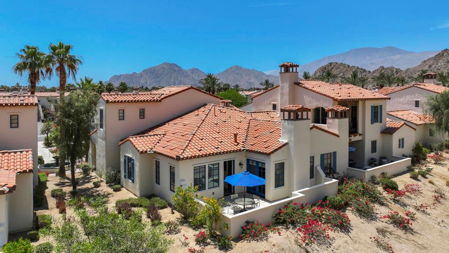 PRIME LOCATION - NESTLED AGAINST MOUNTAINS - Largest Floor-Plan Furnished! Tastefully upgraded two-story townhome offers reimagined open kitchen concept with extended breakfast seating, upgraded appliances 2023, and glass display upper cabinetry. Open Great Room with high ceilings, contemporary fireplace, large dining area and French door and wood shuttered windows to sweeping views of the Santa Rosa Mountains across your private outdoor patio area.  Tile and wood plank floors throughout.  First floor Primary suite with fireplace and double French door to wake-up to breathtaking mountain views every morning, and step out on extended private patio.  Double custom closets, leads you to a bath with separate soaking tub, shower stall and dual sinks.  First floor guest suite with nice separation from Primary also features full bath with separate tub, shower stall and dual sinks.  Second floor bedroom with double beds, and its own ensuite tub, shower and dual sinks.  Powder room off impressive entry.  Completely custom furnished by Restoration Hardware 2020. Extra pantry closet, Owner's closet, laundry room with sink and direct access to 2 car garage.  A/C Compressor 2024. Lower energy cost with IID Electric. Desert Oasis at Legacy Villas Resort Community offers it all!  A 11,000 sq. ft. clubhouse for relaxation & entertainment. Seasonal poolside restaurant, The Legacy Grill, state-of-the-art fitness center, tranquil Date Palm Hammock Garden, 12 sparkling saltwater pools, two of which are exercise lap pools, and 11 spas. The closest pool area to the Townhome is only smaller pool area with restrooms.  Common grounds feature 15 fountains and scenic walking trails and EV charging stations. The main pool area offers poolside cabanas, showers, kids' water fixtures, and a walk-in beach pool. Just outside the guarded gates is famous La Quinta Resort and Club, offering golf, tennis, pickleball, fine dining, and a Spa. (Membership options available.) Also just a short distance to Old Town La Quinta.  Legacy Villas is fully authorized for short-term rentals, making it an excellent opportunity for investment when you're not enjoying it yourself.