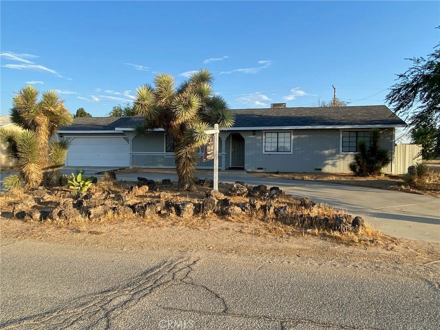 Welcome to your dream home nestled in the heart of burgeoning California City. Boasting of a spacious 1,827 sq. ft. floor plan, this four-bedroom, 2 full bathroom gem , offers an indoor laundry, and a two-car garage that leads to a bonus room for multi-functionality, a rear covered porch and a refurbished kitchen floor that surely will be a delight for culinary buffs with its bay window overlooking a 397 square feet, newly-built 2 airconditioned bedroom, 1 bath ADU (Additional Dwelling Unit). Relax and unwind in the big bonus room with its cozy bar complete with its own sink ideal for family entertainment, friends and other house guests. As you get out in the front yard, enjoy the sight of two precious Joshua trees that adorn the facade, and at night time savor the experience of  stargazing in an untrammeled clear view of the sky and its surrounding environ very rare for one to be at, in a sparsely popupalated rapidly growing city. But this bonus does not end there! The ADU features modern amenities such as double-paned windows, a kitchen, a bathroom and two bedrooms  equipped with new individual air-conditioning units. This ADU offers endless possibilities especially under the current housing crisis, either as a solution, or for additional income or multi-generational living. Truly a unique opportunity for anyone in this quiet and beautiful suburban neighborhood with easy access to the valley and the stupefying Red Rock Canyon Park, just a short drive away. This 10,454 square feet property is close to the town center, the City Hall and a golf course.