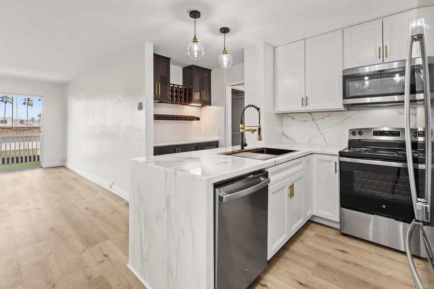 Located in the highly desirable Plaza complex in Pacific Beach, this beautifully refreshed one bedroom, one bath condo showcases stylish upgrades & an exceptional coastal lifestyle. The unit has been renovated throughout with new flooring, fresh interior paint, a brand new kitchen featuring new appliances, countertops, cabinetry, sink & faucet, along with a custom cabinet storage area complete with a wine fridge. The bathroom has been fully updated with a new tub and a sleek double vanity, while new light fixtures throughout the home create a bright & modern feel. The spacious bedroom features a striking board & batten paneled accent wall, adding character & design appeal. Situated in a quiet section of the complex, the unit enjoys views of the tennis courts without public walkways or foot traffic directly outside, providing added privacy rarely found in the community. The Plaza complex features secured entry on all doors, 24 hour security, and resort style amenities including multiple pools, tennis courts, a fitness center with sauna, movie room, billiards room, barbecue area, library, & inviting indoor and outdoor seating areas overlooking the lagoon fountain. The unit includes one assigned parking space in the secured garage with convenient access near the unit. Ideally located close to freeways, shopping, dining, & just minutes from Pacific Beach, this is a must see opportunity in one of San Diego’s most sought after coastal communities.