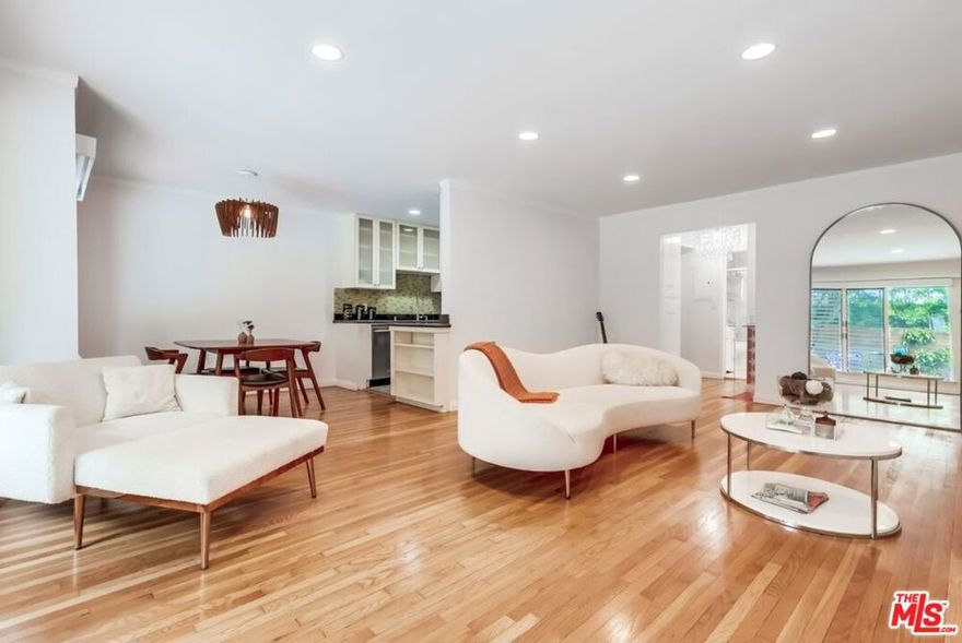 Welcome to your dream home in the heart of vibrant West Hollywood! This stunning 2-bedroom, 2-bathroom condo, nestled on the first floor of the iconic Lawford Building (est. 1957), is a light-filled sanctuary perfect for those seeking style, comfort, and an unbeatable location. Bathed in natural light from an abundance of windows, this unit boasts a breezy, open floor plan that feels both spacious and inviting. Step into the beautifully appointed living and dining area, where gleaming hardwood floors and recessed lighting create a warm ambiance day or night. The kitchen is a chef's delight, featuring sleek counters, a dishwasher, range, microwave, and refrigerator all ready for your culinary adventures. The primary bedroom is a true retreat, complete with an en-suite bathroom showcasing a luxurious, newly renovated steam shower for ultimate relaxation. The second bedroom offers an oversized walk-in closet, providing ample storage and versatility for guests, a home office, or a roommate. Located in a prime West Hollywood spot, you're just steps away from trendy bars, top-notch restaurants, and endless entertainment options. This stylish 21-unit Mid-Century modern complex is well-maintained, with a beautifully landscaped exterior, a sparkling pool, and a welcoming community of residents that give the building its unique charm. Enjoy the convenience of first-floor access with minimal steps, controlled entry for added security, and a quiet position within the building, far from street noise. Water and trash are included in the rent, making life here as effortless as it is enjoyable. Live in a piece of Hollywood history once home to Rat Pack legend Peter Lawford and embrace the good life sipping cocktails by the pool or exploring the vibrant neighborhood. This condo is more than a place to live; it's a lifestyle waiting for you to call it home. Schedule a tour today and discover why this is the perfect place for you!