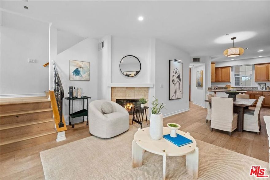 Hot Home!! Beautifully upgraded townhome-style condo in the sought-after Villa d'Este community, designed with the charm of an Italian boutique hotel. You will immediately notice the luxurious touches in this home that sets it apart from other homes in Playa Vista. This remarkable home was a former model home and provides privacy, quality and modern comfort. Just outside, Crescent Park provides a peaceful green escape. Inside, wide-plank white oak floors flow throughout, with new paint, recessed lighting and abundant natural light. The open living area features a cozy gas fireplace, while a spacious private/enclosed patio extends your living space outdoors, perfect for relaxing or dining al fresco (includes a dedicated gas line for outdoor grilling). A built-in office nook offers the ideal spot to work from home. Both bedrooms are generously sized and outfitted with new ceiling fans for year-round comfort. The layout feels more like a townhome than a typical condo, with convenient ground-level access - no stairs or elevators needed! Includes two side-by-side parking spaces plus extra storage cages in the garage. Villa d'Este is a small, intimate community with only 39 residences and includes three serene courtyards, an outdoor fireplace, tiled walkways, colorful bougainvillea, and graceful arches. HOA benefits cover high-speed fiber internet (1GB up/down), cable TV, home security monitoring, and access to pools and fitness centers at both The Resort and The CenterPointe Club. All of this is just moments from Playa Vista's Runway Retail, Concert Park Shoppes, 29 parks, and the many community amenities that make Playa Vista one of LA's most popular and desirable neighborhoods.