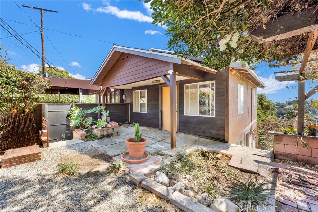 Tucked into the eclectic hills of Mt. Washington sits a home with a rich creative soul. Once the last residence of renowned artist Ynez Johnston, this inspiring retreat embodies the essence of California hillside living—nature, tranquility, sweeping views, and a welcoming sense of community. Set on three lots within two parcels totaling 14,471 sq. ft., it offers not only a unique living experience but also room to expand, create, and make it your own. Designed to spark imagination, the day begins in the bedroom with panoramic canyon views, followed by breakfast in a sunny kitchen where the scenery is always within sight. Continue your day in one of the home’s versatile spaces—perfect for a studio or workshop—where creativity flows as easily as the hillside breeze. With an estimated 1,800 sq. ft. of living space, this three-bedroom, two-bath home sits on a generous double parcel—a rare canvas for your vision. Create a family compound, add an ADU, expand into a grander single-family home, or simply enjoy the grounds already adorned with mature trees, fruit trees, bougainvillea, and succulents while you design your own hillside paradise. Just minutes from the vibrant shops, dining, and entertainment of Eagle Rock, Highland Park, and Downtown, and with quick access to the 110, 2, and 134 freeways, you’re close to everything—yet feel a world away from it all.