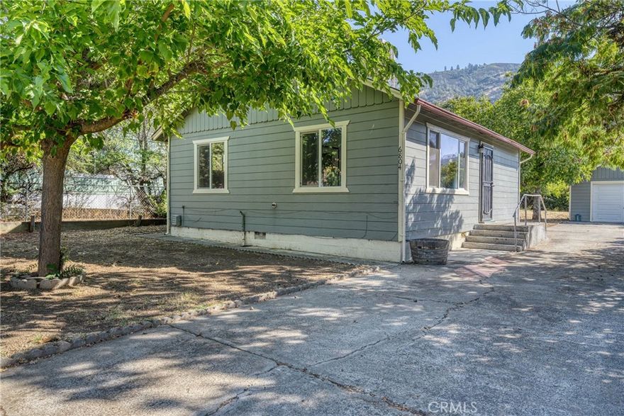 This Charming home offering 2 bedrooms & 1 bath, is located in the heart of Nice, CA. This home is located near parks, shopping, restaurants and walking distance to the beautiful Clear Lake. It's turnkey and upgraded, with ample parking in addition to a 1 car detached garage. Some of the features of this home include beautiful wood cabinetry in the kitchen, brick detail around the heating source in the living room, windows throughout that let in plenty of light and an ideal layout. The expansive, flat lot is fully fenced, featuring a chicken coup, huge garden area & shed for extra storage.