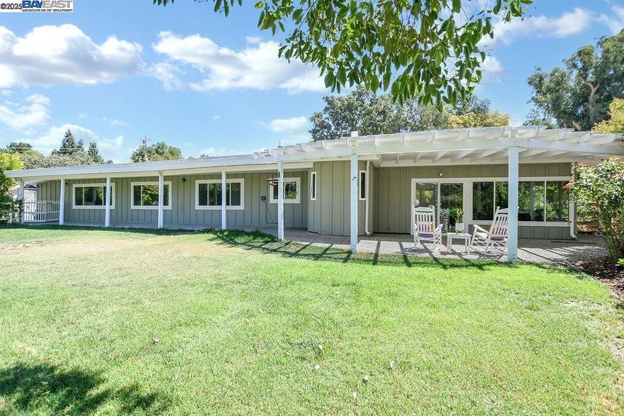 Welcome to a rare opportunity in North Danville’s El Pintado enclave. This 3 bedroom, 2-bath ranch-style home sits on a sprawling 1.23-acre parcel and offers 1,900 Sqft garage conversion Sqft not included. Home has new carpet, fresh paint, and dual-pane windows. The detached two-car garage is currently a studio with separate workspace—ideal for guests, hobbies, or conversion back. A barn on the upper lot offers views and space for horses, storage, or creative use. Enjoy a variety of mature fruit trees—orange, peach, lemon, apple, cherry, grapes, and persimmon. Inside, vaulted ceilings in the dining and family rooms create an airy feel, and the bright sunroom is perfect for relaxing or entertaining. The lot is very usable and provides ample room to expand or customize to your lifestyle. Nestled on a quiet, custom-home community just minutes from downtown Danville and I-680, it offers both tranquility and convenience. Outdoor access is unmatched with Iron Horse Trail, Las Trampas, and Mt. Diablo nearby. Zoned for top-rated San Ramon Valley schools. So much opportunity to make it your own! Come see today! Thurs Oct 2nd 10-2pm + Open Sat & Sun Oct 4 & 5th 2-4pm