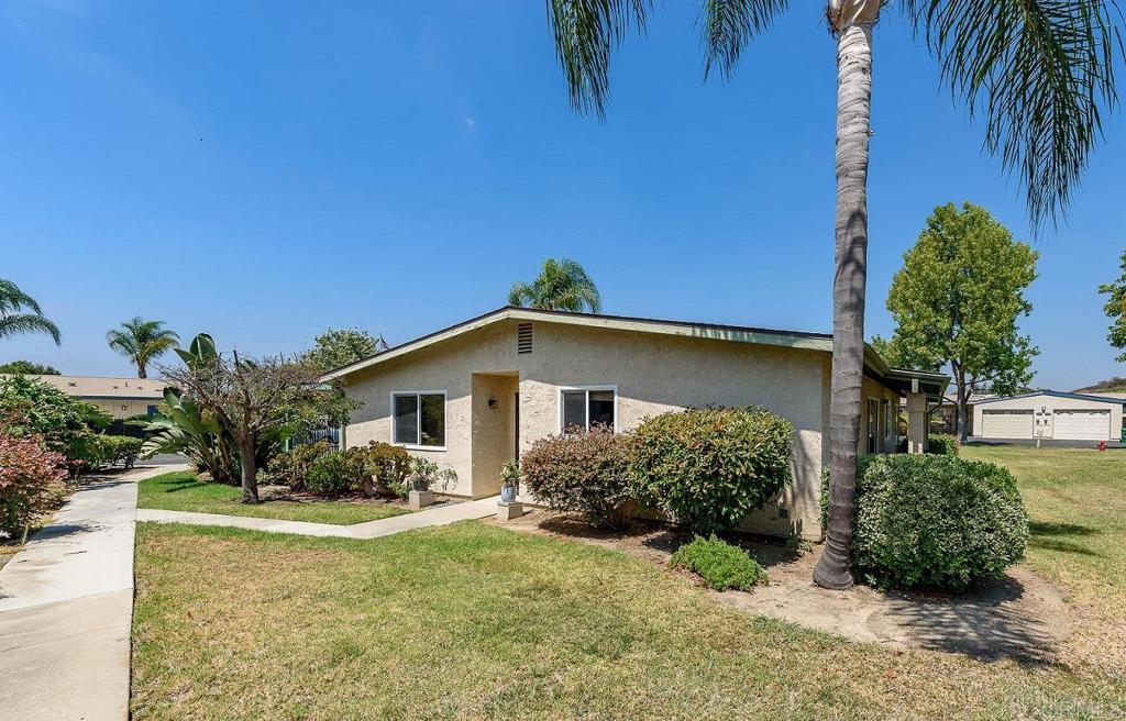 Look no further - REMODELED END UNIT. Fall in love with this beautifully upgraded, charming 2-bed, 2-bath home in the quiet 55+, active-living community of Oceana Mission #1 in Oceanside! Check out the beautiful double sinks in the primary bathroom. Classic tile floors in the kitchen and baths, and new LVP flooring elsewhere. The kitchen and both baths have been upgraded. Dual-pane windows and classic shutters. The private gated carport can be used as a retreat or extra parking, and the 1-car garage includes a washer & dryer. This home is on the West side of the duplex, so cooling breezes are felt more here. Conveniently located across from the pool/clubhouse, The HOA provides access to a clubhouse, pool, spa, plus paid water, sewer, and trash. New roofs in 2024. Limit of two pets. When you are not home, you will enjoy the close proximity to golf courses, parks, shopping centers, and the 76 expressway, which will lead you straight to the vibrant downtown Oceanside, where you can relax at the beach, eat at a local eatery, shop the two weekly Farmers Markets, walk the harbor, and so much more! Only one mile to Kaiser. Also minutes away from the San Suis Rey River, walking and biking trails to the beach. Ralph's, Starbucks, Lowe's, and several restaurants are conveniently located at the bottom of the hill.