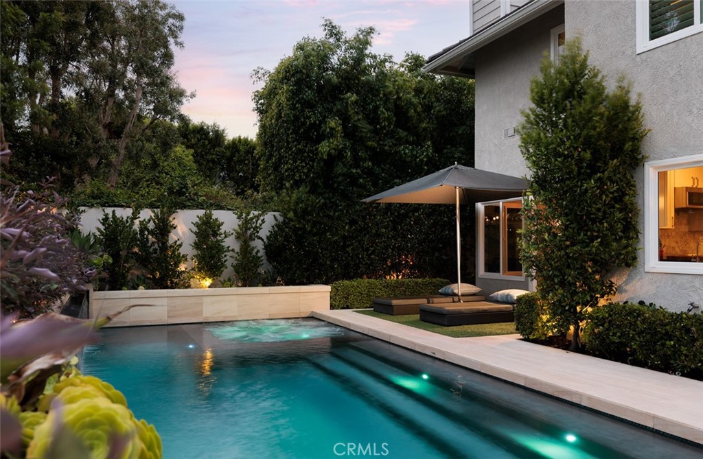 Welcome to your luxurious retreat in the sought-after Somerset Point community of Laguna Niguel. This elegant home blends modern updates and privacy with timeless style, offering an open-concept layout where the kitchen seamlessly connects with the family room. Delight in a chef’s kitchen featuring quartz countertops, white shaker cabinets, a marble tile backsplash, and premium KitchenAid appliances including a dual-zone wine and beverage fridge.
This residence hosts five bedrooms and three baths, including a downstairs bedroom perfect for guests. The primary suite is a sanctuary with a fireplace, spacious walk-in closet, and an updated bathroom featuring a soaker tub and marble tile shower. The upstairs is adorned with new premium pet/kid-friendly carpet and custom interior shutters.
The outdoor space is an entertainer's paradise, designed by John Shippy, with a limestone patio, heated saltwater pool, outdoor kitchen, and a cozy fire pit with built-in seating. Control your outdoor amenities with ease using the Aqualink mobile app and enjoy the ambiance of landscape lighting and a Bose sound system.
Additional upgrades include a durable 50-year concrete roof, a highly efficient HVAC system with air scrubber and Nest control, and the Nuvia Pro Whole House Water Filtration system. Situated on a charming single-loaded street with excellent curb appeal, this home is steps away from parks and Hidden Hills Elementary School, and conveniently close to shopping and the beach. Embrace the Southern California lifestyle in this stunning property—schedule your private showing today!