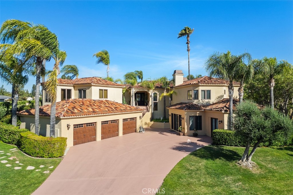 Exceptional custom home located on the 15th fairway of Bear Creek Golf Course. 180 degree, tee to green views from most rooms of this home. Elevator leading to the main living area of this unique home. Made for entertaining featuring huge kitchen, dining and great rooms. Great room and kitchen nook with custom wood beamed ceilings and wrap around windows for breathtaking views of backyard and golf course. Gourmet kitchen with top of the line stainless steel Viking appliances throughout, granite counters, custom build cabinets with lighting, center island and peninsula breakfast bar. Oversized "L" shaped walk in pantry and laundry room for duel washers and dryers. Breakfast nook with custom built in banquette. Huge great room with media center and room for all your games. Master suite features coffered ceiling and fireplace. Master bath with walk in shower, separate spa like tub, double sinks, vanity and large walk in closet. Off master suite on main living area you will find the inclosed "California" sunroom with an A/C unit and TV. Lower level with 2 bedrooms and spectacularly remodeled bath, 4th bedroom/gym with walk in closet and separate bathroom. 4th garage converted to office/5th bedroom, your choice. Stunning back yard boasts: Pool, Spa, built in BBQ, fire pit and putting. This home is truly an entertainers and golf enthusiast's dream. A must see on your list !!
