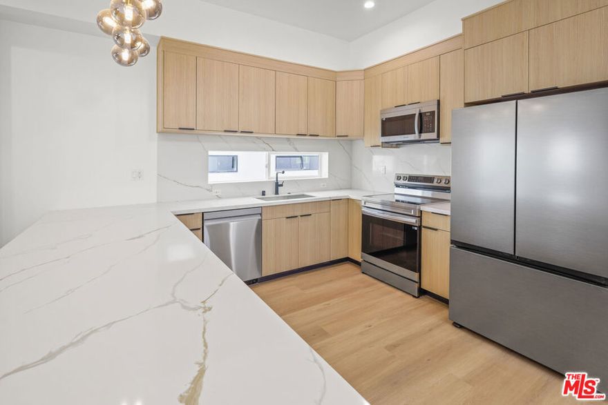 ** PET FRIENDLY ** PRIVATE ROOFTOP DECKS ** 2-CAR ASSIGNED PARKING ** WASHER/DRYER ** CENTRAL A/C ** KITCHEN ISLAND ** PRIVATE YARD ** Welcome to Hortense Townhomes, a brand-new luxury residence in the heart of North Hollywood offering high-end finishes, spacious interiors, and unbeatable amenities. These thoughtfully designed units feature expansive living rooms, oversized bedrooms, and open-concept layouts perfect for modern living. The chef's kitchen boasts a large island, beautiful stainless steel appliances, quartz countertops, and custom cabinetry. Each unit includes an in-unit washer and dryer, central A/C and heat, recessed lighting, and premium flooring throughout. Enjoy your own assigned parking space for added convenience. The building is pet-friendly and offers an incredible shared rooftop deck with sweeping city views for relaxing, entertaining, or working from home in style. Located on a quiet residential street yet minutes from the vibrant NoHo Arts District, Toluca Lake, studios, shops, restaurants, and transit. This is elevated urban living at its finest. Don't miss your opportunity to call it home! **