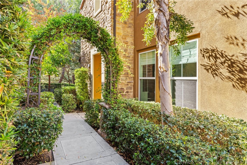 This chicly redesigned 2-bedroom plus office, 2-bath condo has been beautifully updated with gorgeous hardwood flooring, painted walls, and elegant lighting fixtures. Enter the home to the large living/dining room with electric fireplace and many charming windows. The open-concept kitchen features new appliances and a sophisticated redesign of the cabinetry. Also enjoy an amply sized den/office area. Both bedrooms are spacious and newly carpeted. The primary bathroom is luxurious with both a glass walk-in shower and a large accent bathtub. The twin vanity matches the room with its white marble counter and abundant cabinetry. The second bath is similarly designed, with a single vanity and shower/tub combo. Located nearby are multiple schools, businesses, and amusements including the University of California - Irvine, the Shady Canyon Golf Club, and many beautiful nature trails to hike and explore. Don’t miss the chance to see this beautiful home in person - call today to schedule a tour!