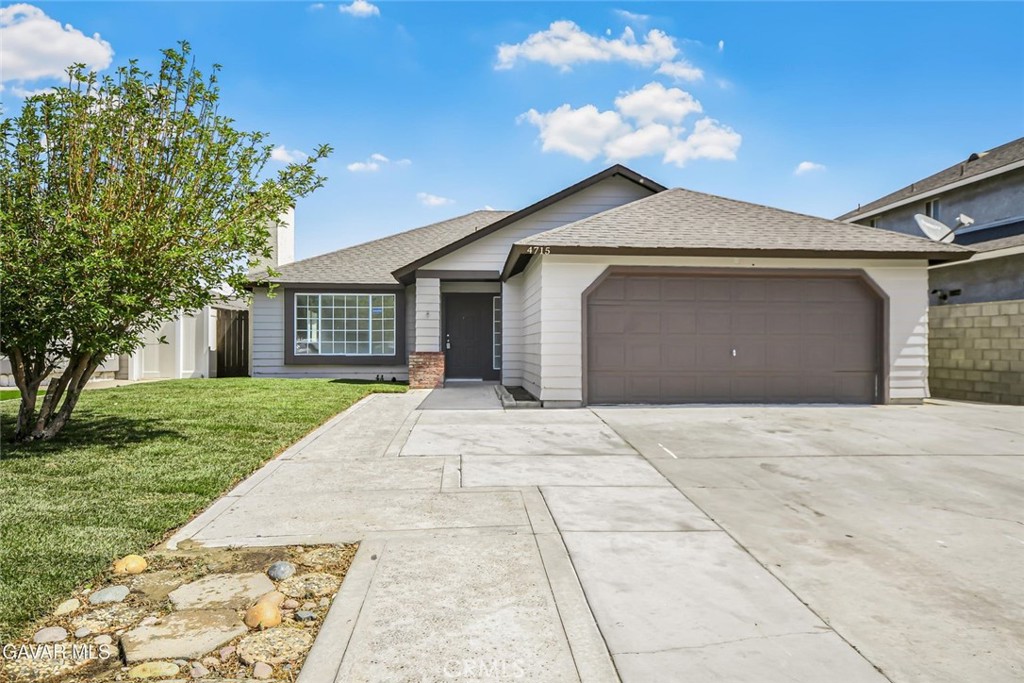 This fully renovated home is move-in ready and shines from the moment you pull up, starting with fresh new paint inside and out that gives the entire property a crisp, modern look. Step inside and you'll immediately notice the gorgeous, brand new plank flooring that runs throughout the entire home, beautifully complemented by new 4'' baseboards, updated light fixtures, and all new plumbing fixtures that add a fresh, clean feel in every room. The completely remodeled kitchen is a showstopper with brand new cabinets, sleek countertops, a new stainless steel sink and appliances, and a modern faucet—all tied together with matching new flooring for a seamless finish. The formal dining area sits right off the kitchen, perfect for entertaining, and the home offers two spacious living areas for added flexibility and comfort. Both bathrooms have also been fully upgraded, featuring new vanities with fresh tops, new toilets, stylish faucets, and new flooring for a consistent and modern design. A cozy gas fireplace adds warmth and charm to the main living space, and the home offers practical touches like a dedicated indoor laundry room and an attached two-car garage. The exterior is just as inviting, with lush new grass in the front yard enhancing the home's curb appeal. Centrally heated and cooled for year-round comfort, this home sits in an excellent location close to everything. Come see this stunning renovation for yourself—this is a rare offering you won't want to miss!