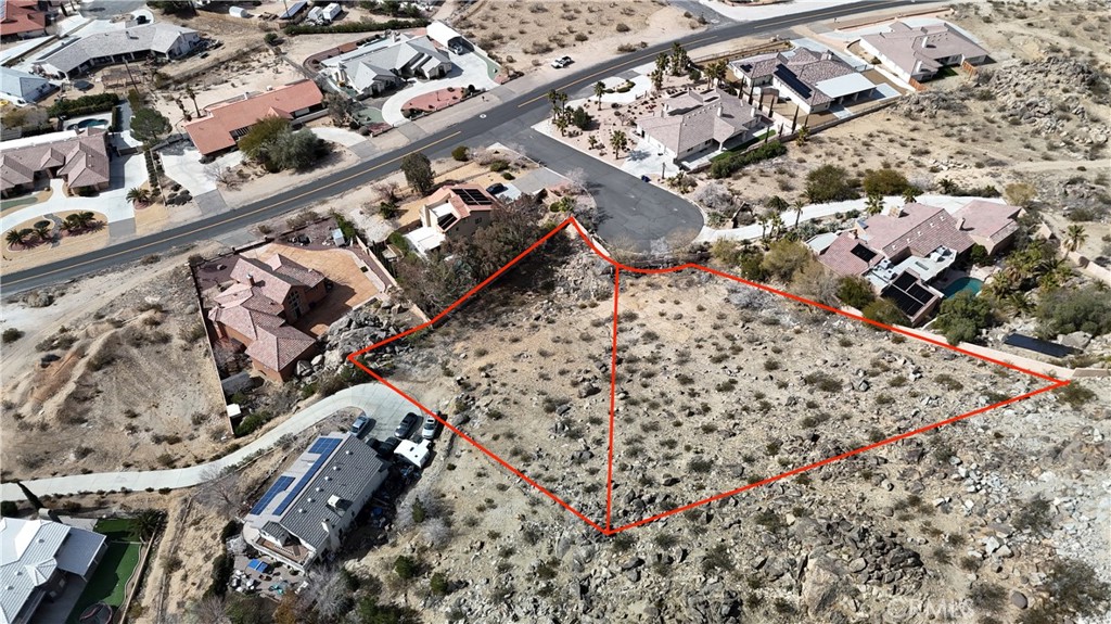 APPLE VALLEY - TWO LOTS - Discover an unparalleled opportunity to build your vision in Desert Knolls community! This is not just one, but two adjacent separate lots, offering a combined 1.3 +/- acres of prime real estate. Must be sold together and will provide the space and flexibility you need to create a truly magnificent custom estate. Nestled at the end of a cul-de-sac, these two lots are surrounded by custom homes. Enjoy panoramic views that stretch across the High Desert landscape, offering a picturesque backdrop for your future residence. You'll have the best of both worlds: The tranquility of a secluded setting with the convenience of urban amenities just minutes away. The property is ideally situated close to the area's leading hospital, a bustling medical and professional corridor, and provides quick and easy access to the I-15 Freeway. Don't miss this rare chance to secure a sizable piece of land in one of Apple Valley's must sought-after neighborhoods. The possibilities are endless for creating a unique home. Buyer must perform all their own due diligence to verify all aspects of the property and its suitability for their intended use. This is your opportunity to build not just a house, but a legacy!