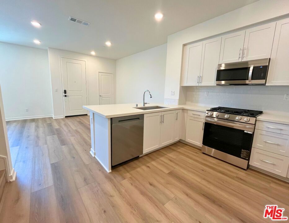 Look no further for your new-construction townhome! This home has it all including stylish upgraded flooring, sleek full backsplash, quartz counters, upgraded hard-surface flooring, plush carpet, and energy-efficient features throughout. Inside, the open-concept main level brings the living, dining, and kitchen areas together in a way that feels effortless and inviting. Soft daylight moves through the space, enhancing the clean finishes and intuitive layout. The kitchen features a peninsula with seating, generous cabinet space, and just the right amount of workspace for everyday ease. Upstairs, all three bedrooms are grouped together for convenience and comfort. The primary suite includes a walk-in closet and a private bath with dual sinks and a walk-in shower. Two additional bedrooms offer flexibility for guests, work-from-home setups, or hobbies. The laundry area is thoughtfully placed on the same level, no hauling baskets up and down the stairs. Virtual tour is of former model home and used for representational purposes only.