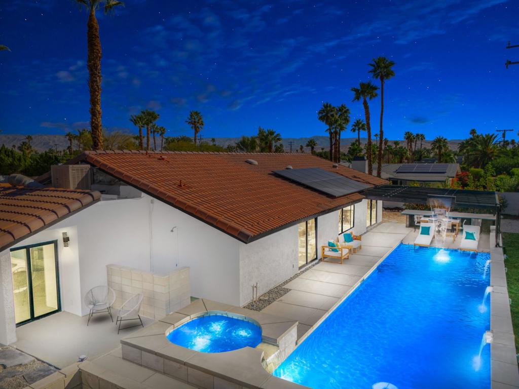 Stunning, Highly Upgraded Palm Springs Home with Exceptional Pool and Guest House Potential. Welcome to 2171 E Francis, a meticulously upgraded Palm Springs residence that blends modern luxury with thoughtful design. This spacious four-bedroom, three-bathroom home is an entertainer's dream, offering both style and comfort in equal measure. One of the standout features of this property is its versatile fourth bedroom and bathroom, which can function as a separate apartment with its own private entrance - perfect for guests. Inside, every detail has been thoughtfully considered. The three beautifully tiled bathrooms feature custom design elements, including two luxurious tubs and three zero-elevation custom showers, all with new high-end fixtures. Throughout the home, new doors, hardware, and baseboards are complemented by sleek 2' x 4' floor tiles that provide a seamless flow from room to room. Enjoy the warmth and ambiance of four fireplaces located throughout the property - one in the living room, two in the primary suites, and one in the patio area. These add an inviting touch to both indoor and outdoor spaces. The home also features a paid-for solar power system, offering energy efficiency and peace of mind. A brand-new five-ton AC system has been installed, complete with new ductwork and return grates. It also boasts smart technology controls for optimal climate control. In the heart of the home, the kitchen and bathrooms have been fully remodeled with new modern cabinetry, self-closing drawers and doors, and stunning white quartzite countertops. The kitchen is outfitted with new Frigidaire appliances, ensuring both functionality and style. The outdoor area is an absolute highlight of this home. The next-level pool area is ideal for relaxing or entertaining, featuring beautiful surroundings that enhance the tranquil, desert-inspired lifestyle. This home truly has it all: luxury upgrades and a prime location in beautiful Palm Springs.