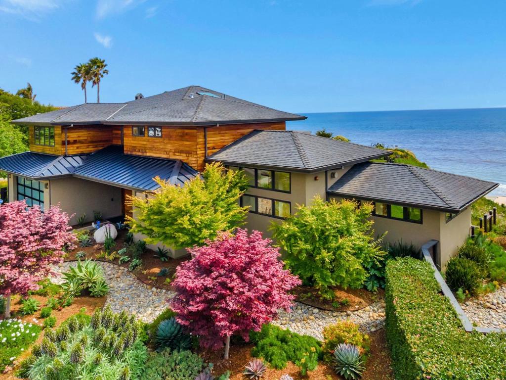 Experience luxury coastal living at 616 Bayview Dr, a refined modern retreat built in 2015. With PANORAMIC OCEAN VIEWS from every bedroom, each with its own en-suite bathroom, this home is an exceptionally rare find. The front door opens to a breathtaking view of the ocean, revealing soaring ceilings and a dramatic fireplace in the great room. From there, a chefs kitchen flows into the dining and family rooms, where wall-to-wall accordion doors lead to a sun-drenched patio, BBQ area, and lawn perfect for entertaining. The first-floor luxurious primary suite offers a fireplace, office, spa-inspired bath with freestanding tub, and huge walk-in closet. Upstairs, you'll find a full second primary suite, complete with a walk-in closet and romantic private terrace overlooking Monterey Bay. Two more spacious bedrooms, a private balcony, a laundry room, and a cozy reading nook complete the upstairs. Located in a quiet, desirable neighborhood, this home is just a short stroll to the beach and a short drive to amenities, Nisene Marks, Seascape Golf Club, and many other Aptos gems. Don't miss this unparalleled opportunity.