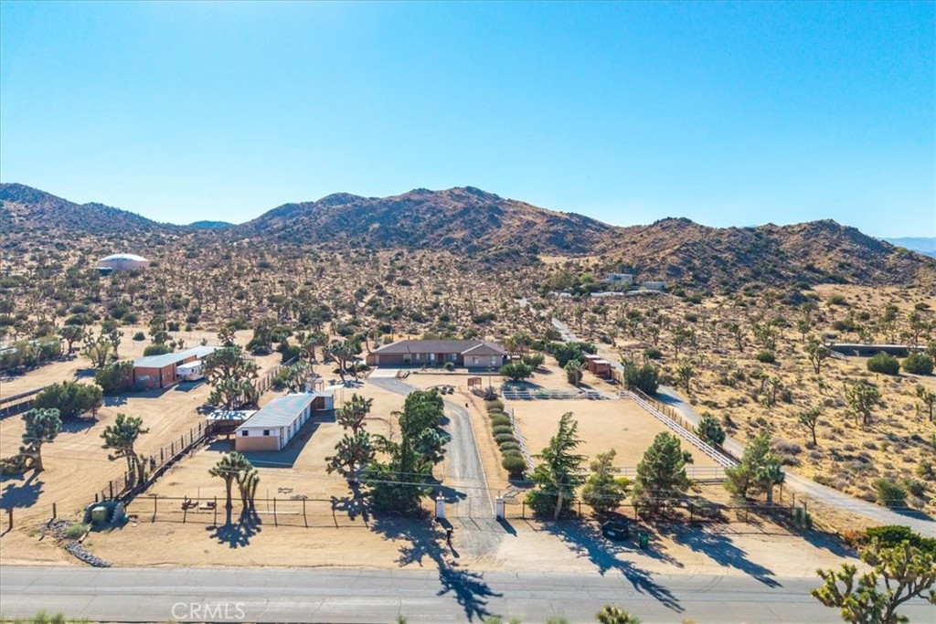 Discover the potential of this spacious Yucca Valley property, offering a unique combination of comfort, space, and rural charm. The home features 4 generous bedrooms and 3 full bathrooms, with the entire interior freshly painted, complemented by tile flooring and plantation shutters throughout.
While the home may benefit from a little TLC, it provides a strong foundation to customize and design to your personal style. Set on an expansive 1.99-acre lot, the property includes a horse stable and a dedicated horse training/riding ring, making it an excellent choice for equestrian enthusiasts.
Enjoy the tranquility of wide-open spaces with stunning mountain views, and take advantage of the property’s proximity to nature. Located within walking distance to the Black Rock Canyon Campground, this home is perfectly situated for those who value outdoor living, hiking, and serene desert landscapes.
This property offers plenty of room to relax, entertain, and create your ideal desert retreat.