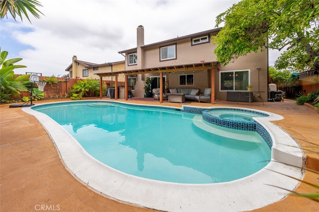 Welcome to your private retreat in one of Chula Vista’s most sought-after neighborhoods! This spacious 4-bedroom, 3-bath single-family home with paid off solar, offers the perfect blend of comfort, style, and convenience—complete with a sparkling pool, relaxing spa, and lush, tropical landscaping featuring mature fruiting lemon, apricot, grapefruit, orange, and avocado trees. Towering palms and vibrant foliage create a serene, resort-like atmosphere right in your backyard.
Designed for entertaining, the outdoor space includes built-in cooking, dining, and lounging areas ideal for gatherings or quiet nights under the stars. Inside, you'll find beautifully updated interiors, including rich wood laminate flooring in the lower living areas, custom tile on the stairs and patios, and a well-appointed kitchen with stainless steel appliances, wood cabinetry, and stylish accents.
The spacious primary suite features a remodeled bathroom with spa-like finishes and a private balcony for peaceful morning coffee or evening sunsets. The home offers ample storage throughout and thoughtful design details that make everyday living easy and enjoyable.
Located just a short walk to top-rated schools and beautiful local parks, this home is also conveniently close to all the amenities you need—shopping, dining, grocery stores, fitness centers, and more. With nearby access to major military bases, including Naval Base San Diego, Naval Amphibious Base Coronado, and the 32nd Street Base, this home is ideal for military families or those seeking a quick commute.
This is the one you’ve been waiting for—resort-style living, unbeatable location, and all the comforts of home.