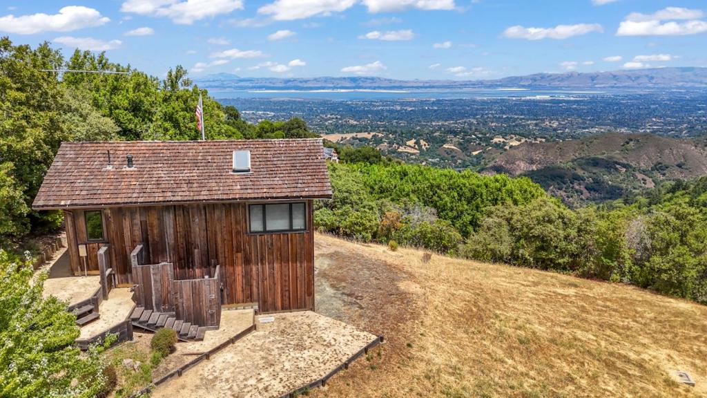 Welcome to a truly rare opportunity in the Palo Alto hills. 10 acres of peaceful, private land with panoramic views stretching across the Bay. Whether you're dreaming of building a one-of-a-kind estate or creating a quiet retreat, this property offers the kind of space and setting that's nearly impossible to find this close to Silicon Valley. A permitted studio structure is already on-site perfect as a creative space, weekend getaway, or base camp while you plan your future build. Located in Palo Altos Open Space district, the property offers generous development potential, with the possibility to build up to approximately 17,400 square feet, including all structures and paved areas.* The land is also under the Williamson Act, which means significantly reduced property taxes a big plus for long-term owners. Gorgeous views, total privacy, and endless potential, this is one of those rare properties that really lets you dream big. *Buyers are advised to independently verify all development potential and requirements with the Town of Palo Alto.