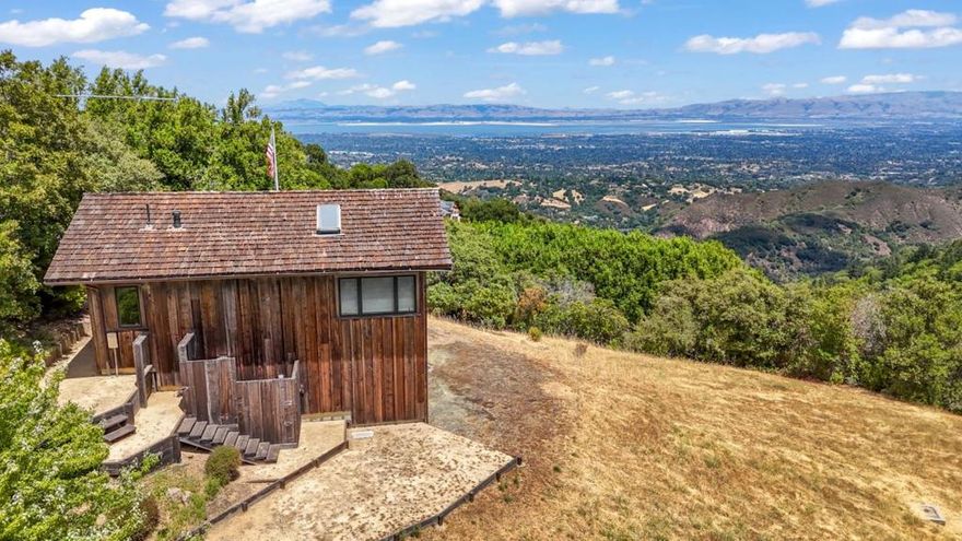 Welcome to a truly rare opportunity in the Palo Alto hills.  10 acres of peaceful, private land with panoramic views stretching across the Bay. Whether you're dreaming of building a one-of-a-kind estate or creating a quiet retreat, this property offers the kind of space and setting that's nearly impossible to find this close to Silicon Valley.  A permitted studio structure is already on-site perfect as a creative space, weekend getaway, or base camp while you plan your future build. Located in Palo Altos Open Space district, the property offers generous development potential, with the possibility to build up to approximately 17,400 square feet, including all structures and paved areas.*  The land is also under the Williamson Act, which means significantly reduced property taxes a big plus for long-term owners.  Gorgeous views, total privacy, and endless potential, this is one of those rare properties that really lets you dream big.  *Buyers are advised to independently verify all development potential and requirements with the Town of Palo Alto.
