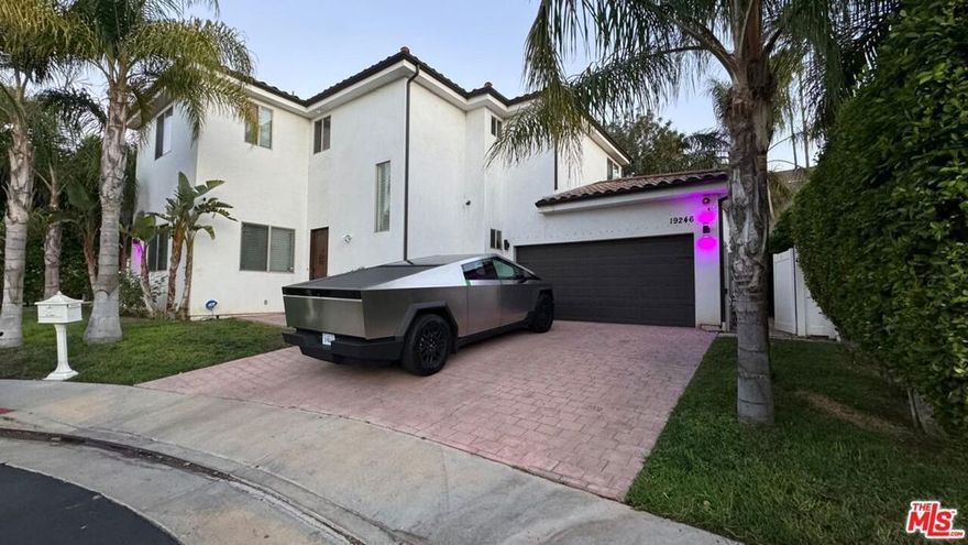 Comes with approved city plans for an ADU!! Welcome to your dream home tucked away in an intimate, gated culdesac community in prime Tarzana. This contemporary Mediterranean gem blends refined finishes in a fully gated resort-quality community providing security and safety, and a thoughtful floor plan perfect for luxury living and entertaining in style. Step inside to a bright, open-concept layout where natural light streams through large windows and French doors. Elegant flooring transitions from tile on the main level to warm wood upstairs. The living room with a built-in entertainment wall is ideal for hosting or relaxing. The chef's kitchen features a center island, premium cabinetry, granite counters, and stainless appliances. A main-level guest suite or flexible bedroom adds versatility, while upstairs hosts three spacious bedrooms, each with ensuite access or dedicated baths. The luxurious primary suite offers a spa-like bath, soaking tub, separate shower, and a generous walk-in closet. Upstairs laundry adds convenience. Step outside through the beautiful glass French doors to your private outdoor living space. The gated backyard is your personal oasis featuring a large heated spa, lush landscaping, and room for lounging or al fresco dining. Mature planting and gated walls create a tranquil environment. The home is further secured by gated entry, exterior lighting, and security features. Located just off Tampa Ave with easy access to the 101 freeway, this home is convenient to shopping, dining, parks.. The neighborhood offers both privacy and connectivity. Top-rated schools in the area include Vanalden Avenue Elementary and Sherman Oaks Center for Enriched Studies.
