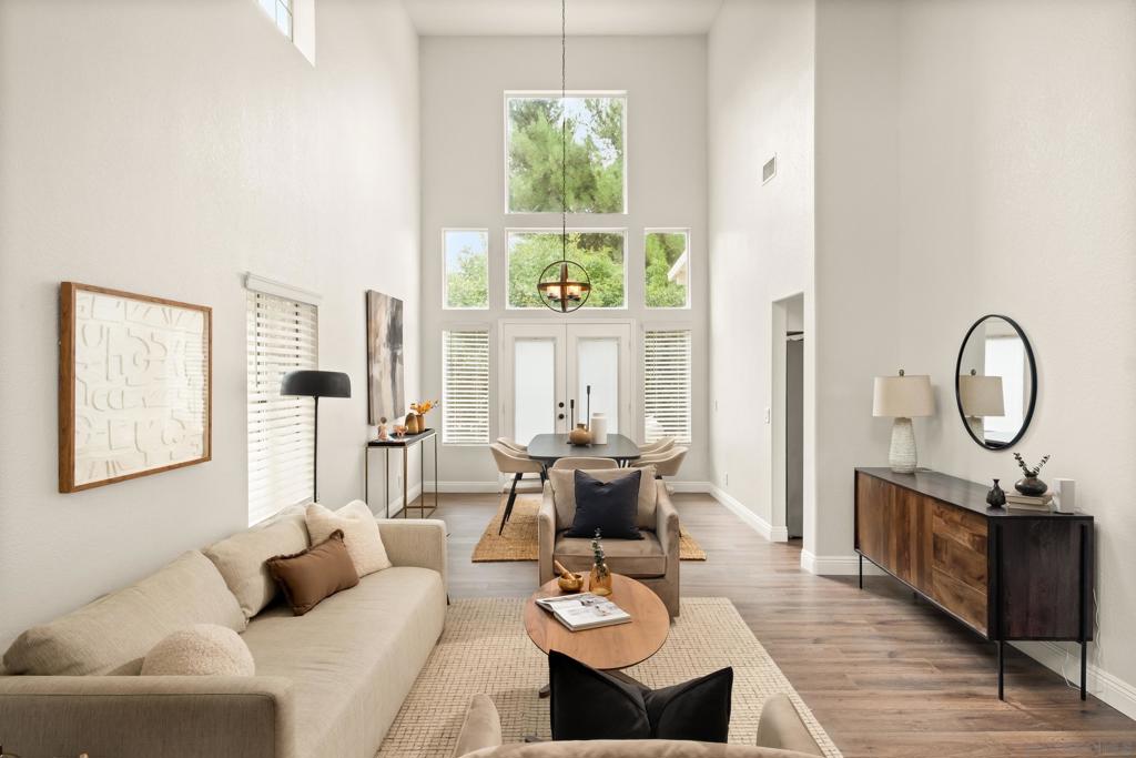 Looking for top-rated schools, stunning views, and everyday comfort? This 5-bedroom, 3-bath home in Temecula’s desirable Redhawk community delivers it all. A downstairs bedroom with a full bath offers ideal privacy for guests or multigenerational living. Upstairs, the primary suite boasts sweeping canyon views, a dual fireplace, spa-like remodeled bath, soaking tub, and expansive walk-in closet. A second oversized suite and two additional bedrooms provide plenty of space for family. The remodeled kitchen features country-style finishes and a bright solarium window with incredible views, opening into a spacious great room with soaring ceilings and natural light. Enjoy a private backyard framed by mature trees and cooled by Temecula’s signature ocean breezes—perfect for relaxing or entertaining. Just blocks from award-winning Great Oak High School and minutes from golf, wineries, and Old Town Temecula, this home is an investment in both lifestyle and future.
